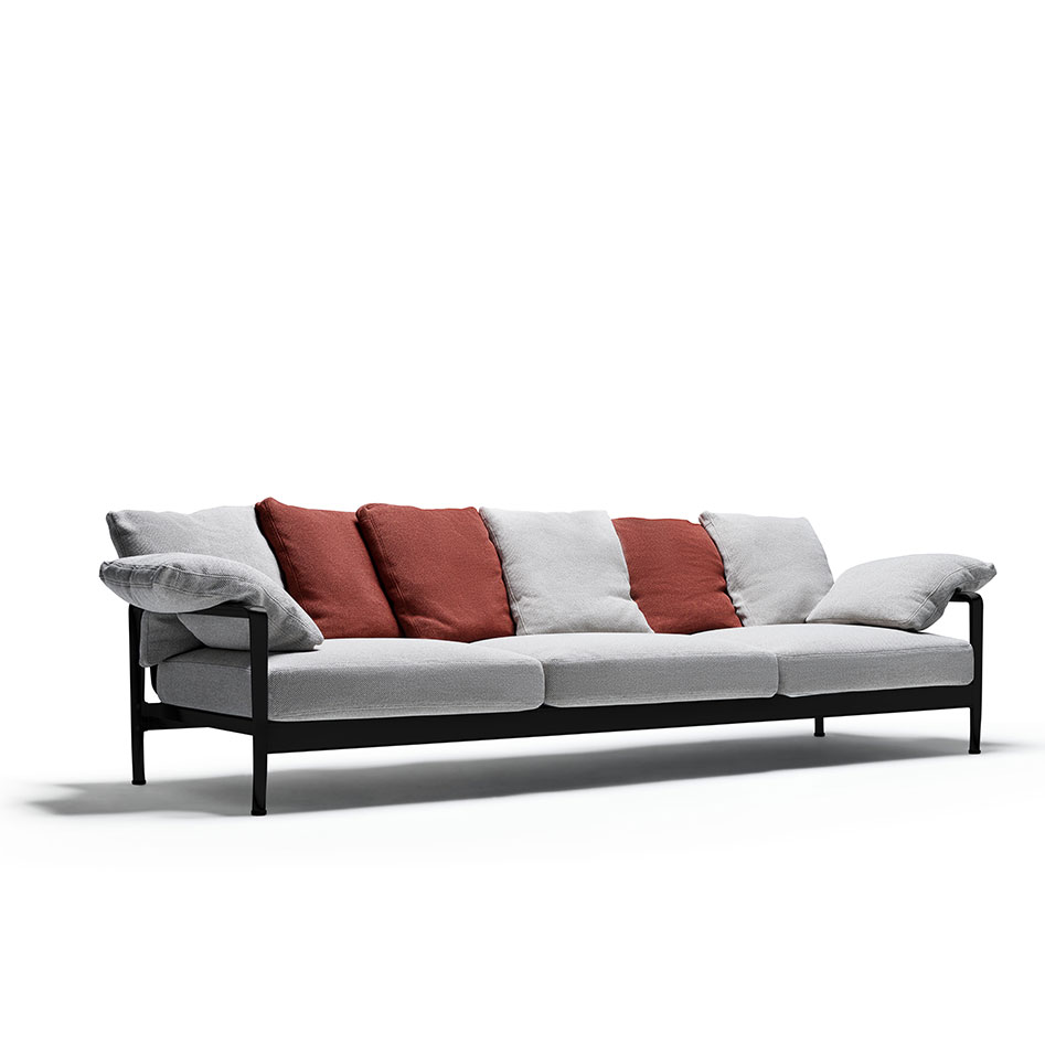 Knoll Sofa Lissoni mit schwarzem Gestell, hellen Polstern und rostroten Kissen
